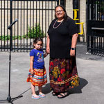 Former Algonquin Anishinabeg Nation Tribal Council Grand Chief Verna Polson standing with her granddaughter in the infill site.