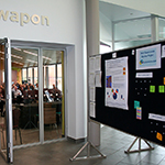 An information board set up outside the workshop entrance.