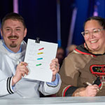 Photo of Premier Akeeagok holding up agreement.